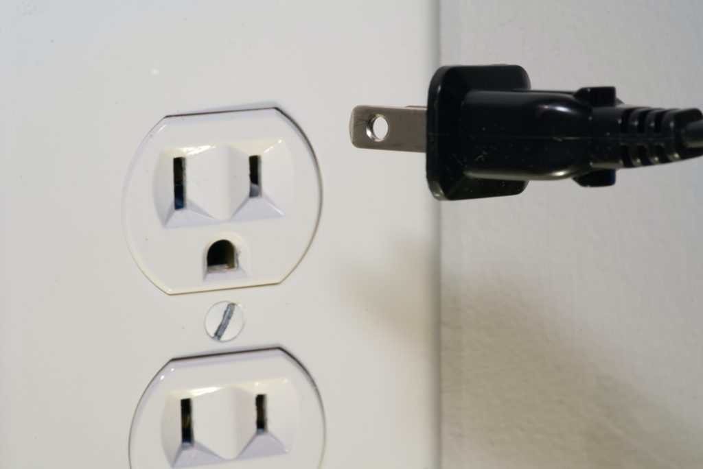 What is behind that Receptacle outlet plate?